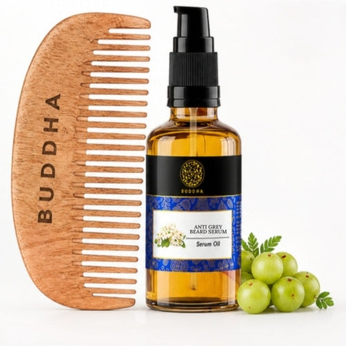 Wooden comb and bottle of Buddha Anti Grey Beard Serum with grapes on a white background